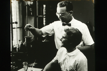 A man and a woman scientist at a lab bench
